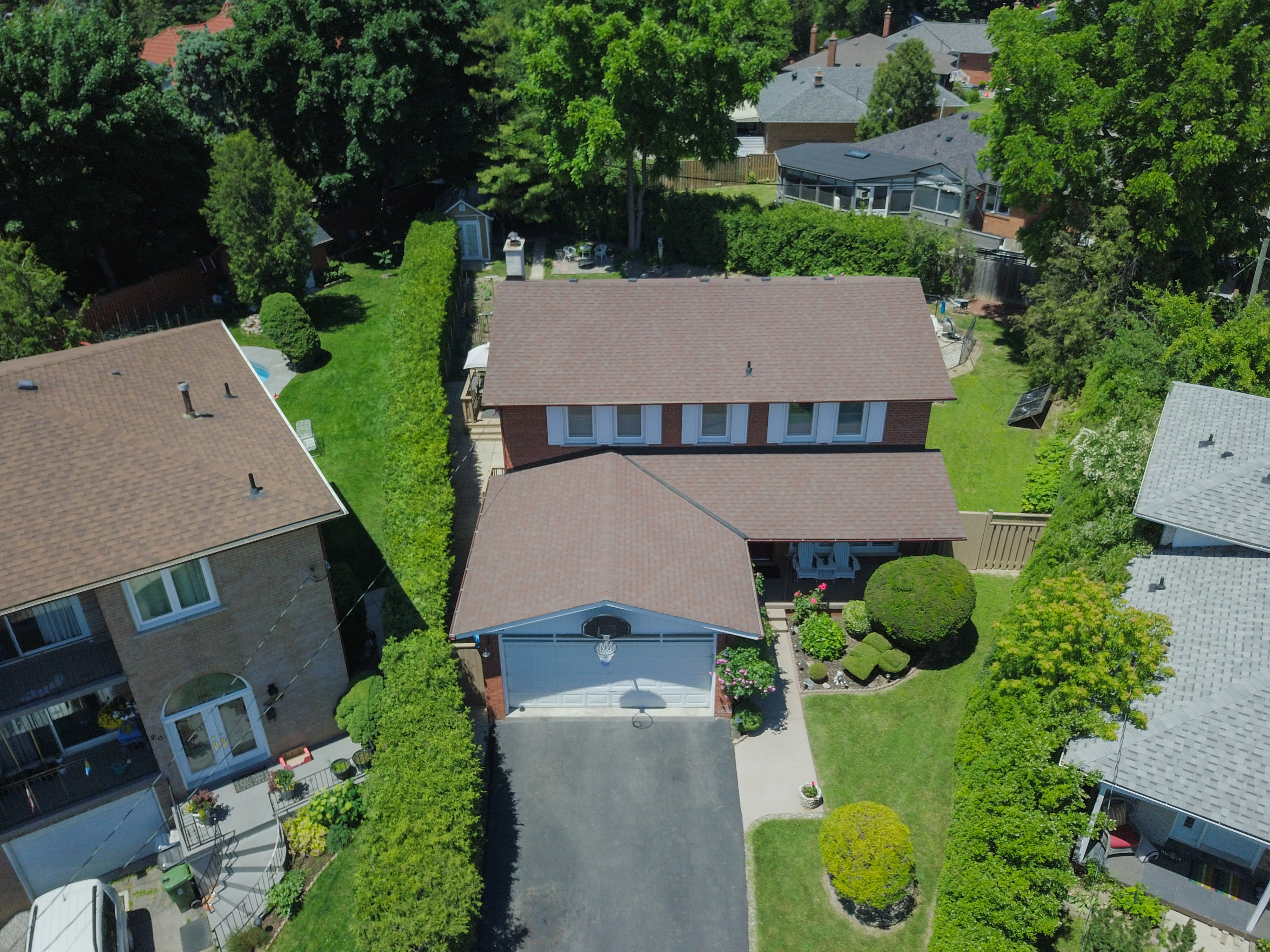 Front view of the house showing the driveway and landscaping